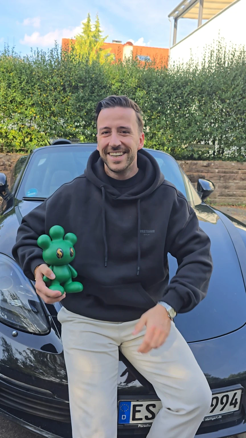 Sven Micklitz with a physical green MIKKI collectible